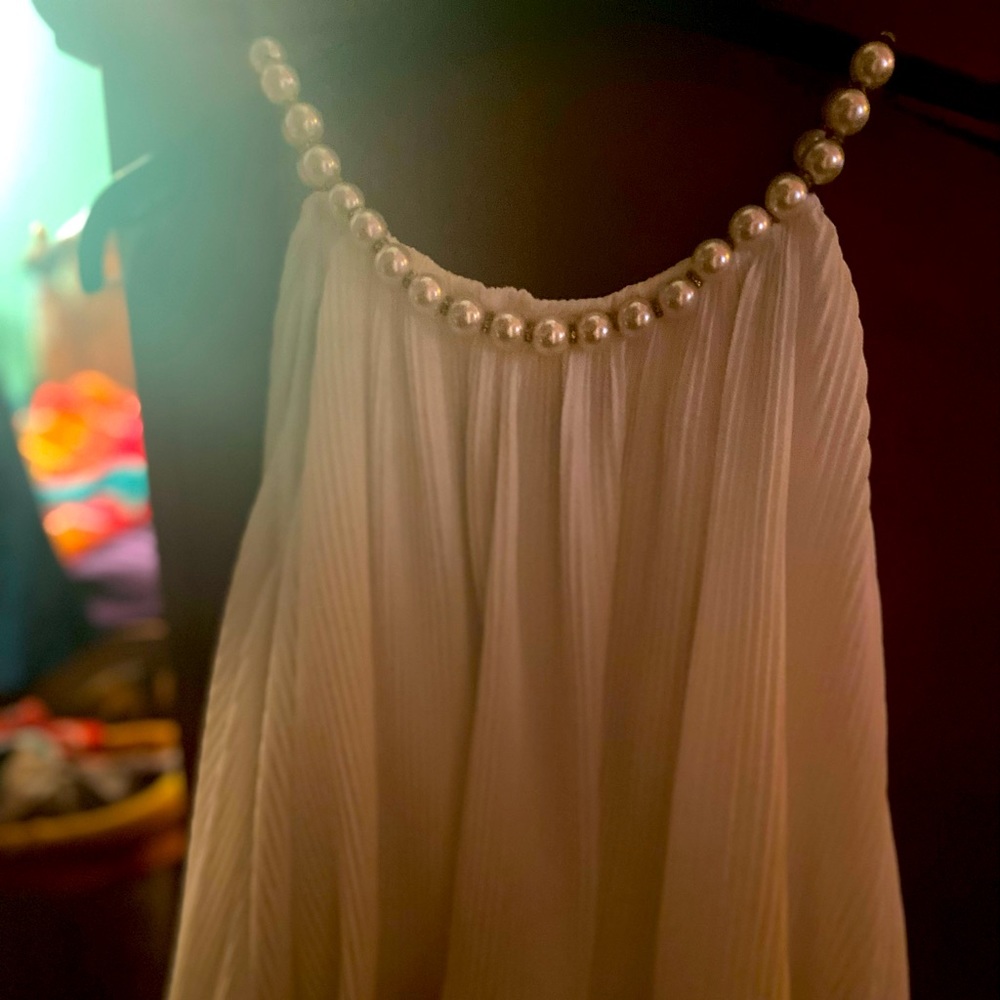 Pearl strap top.